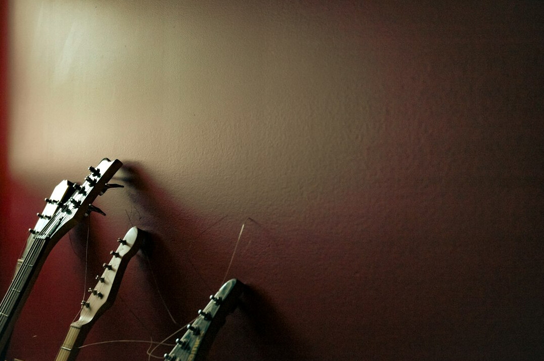 Camera set up in front of a coloured studio wall