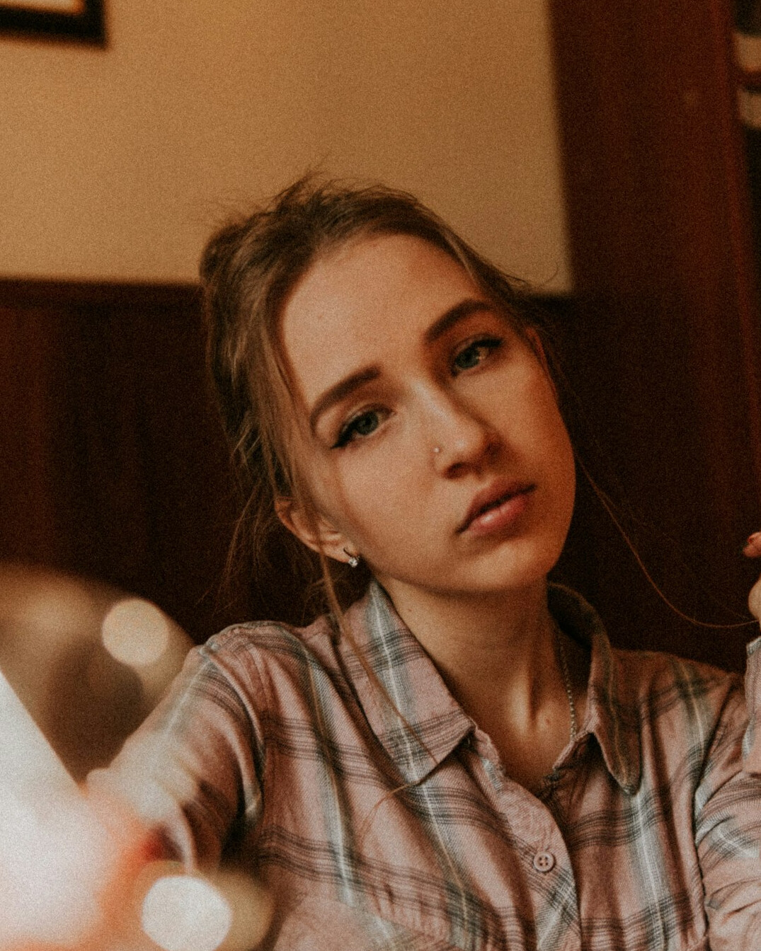 Portrait of a woman broadcast engineer in a checkered shirt