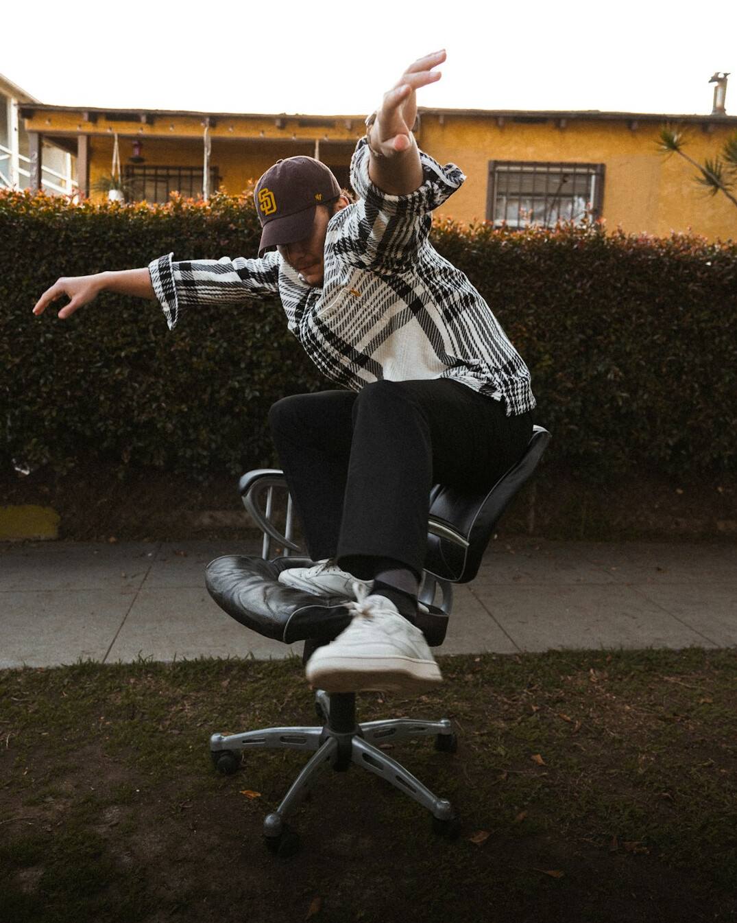 Portrait of a male camera operator sitting on an office chair